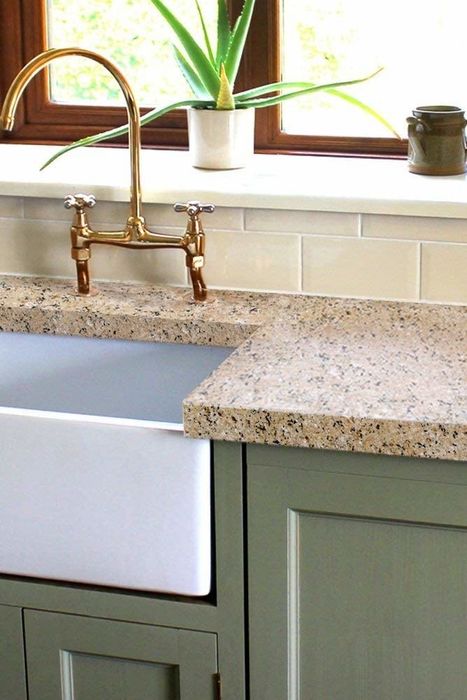 A model countertop transformed with the redo kit, showcasing a light granite finish.