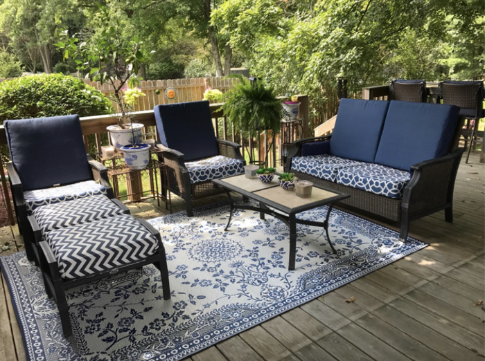 An outdoor rug tying together the patio furniture, creating a more cohesive and inviting space.