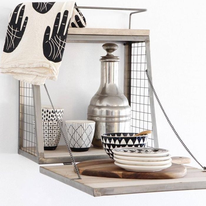 An open view of the cubby, displaying dishes and other kitchen essentials stored neatly inside.