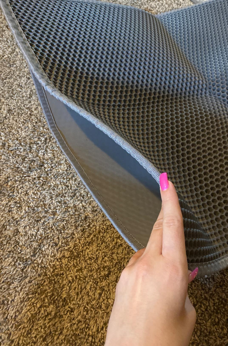 A reviewer demonstrating the interior of the mat by holding it open