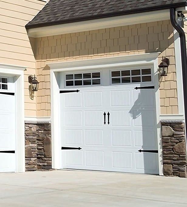 Garage adorned with magnets on both corners, and two handles positioned in the center