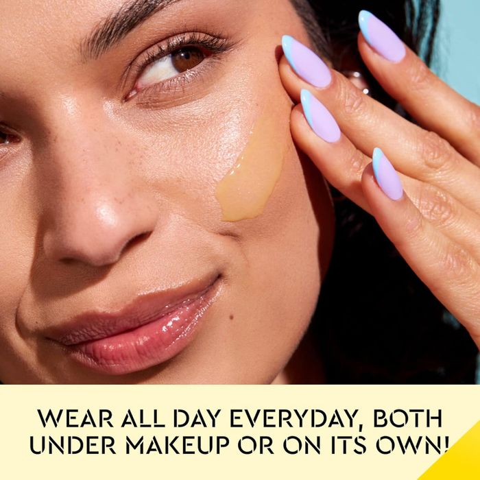 A model demonstrates how to apply foundation on her cheek with accompanying text.