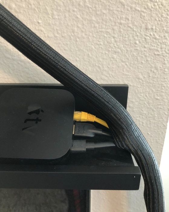A cord protector placed over several cables