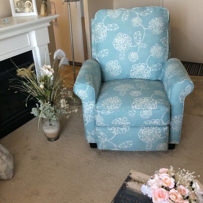 A blue chair showcased in a reviewer's living space