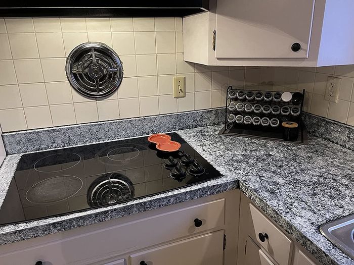 A reviewer's countertop featuring a grey granite effect, giving the space a sleek new look.