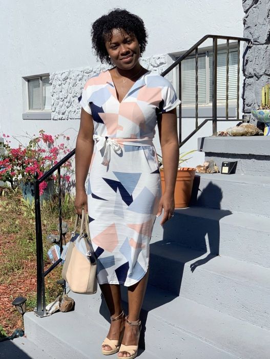 A reviewer showing off the dress