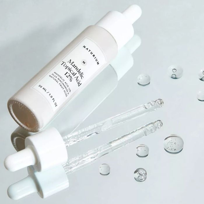 An open bottle of serum, ready for use in your skincare routine.