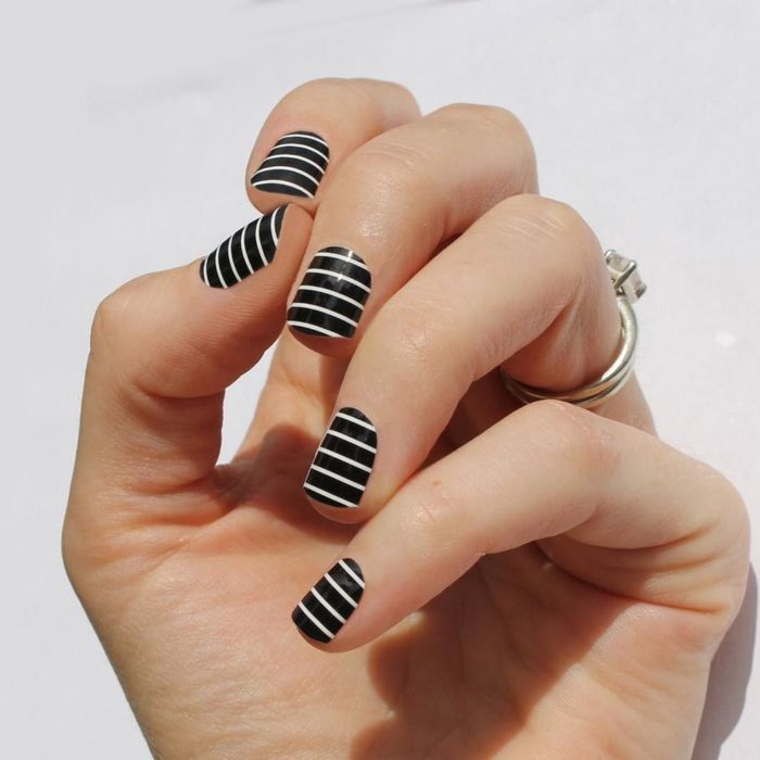 nails showcasing a variety of black and white striped patterns