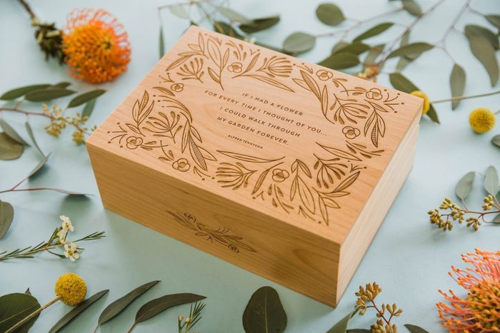 a keepsake box featuring finely etched wood with intricate designs