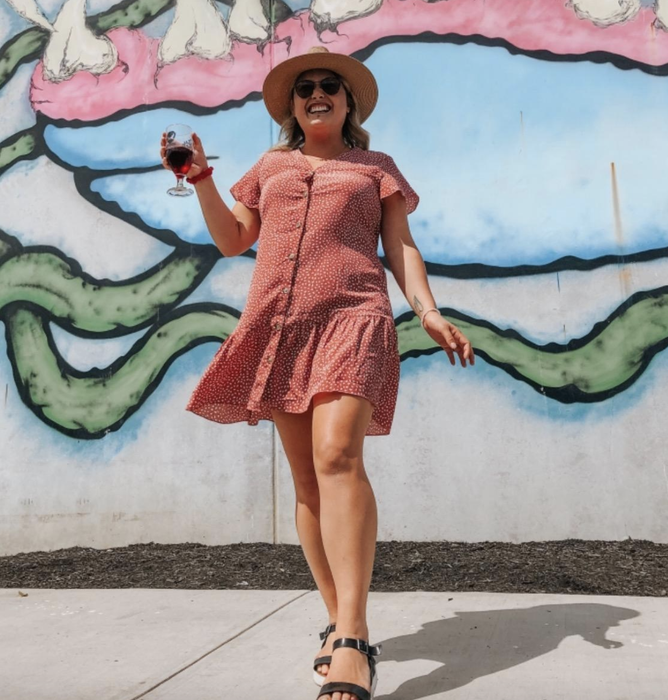 A customer wearing the red dress