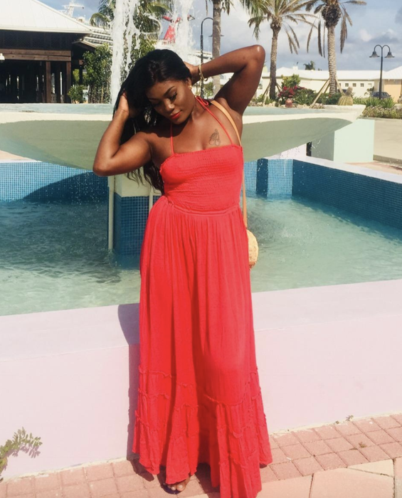A customer wearing the red dress
