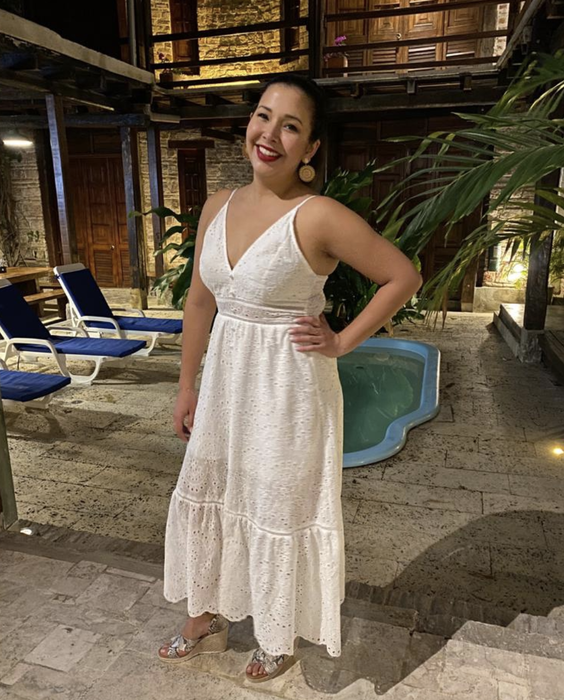A reviewer showing off the white dress.