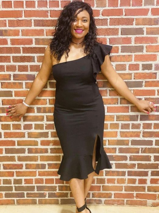 A customer showcasing the dress