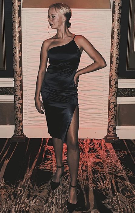 A customer wearing the black dress