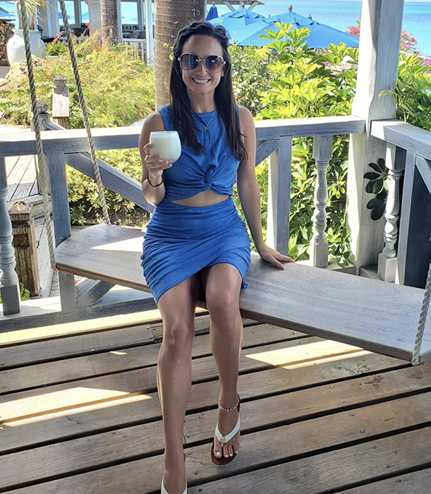 A customer wearing a blue cutout dress