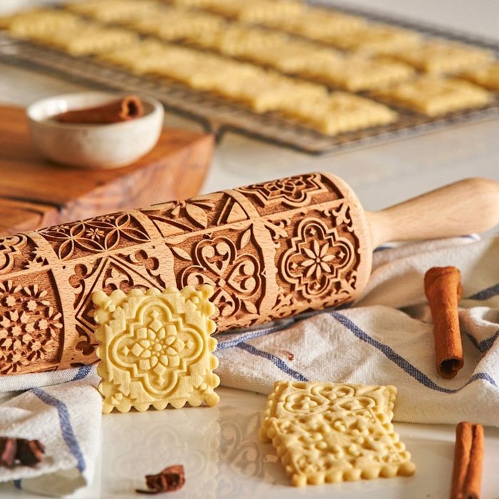 a rolling pin showcasing a detailed mosaic tile design