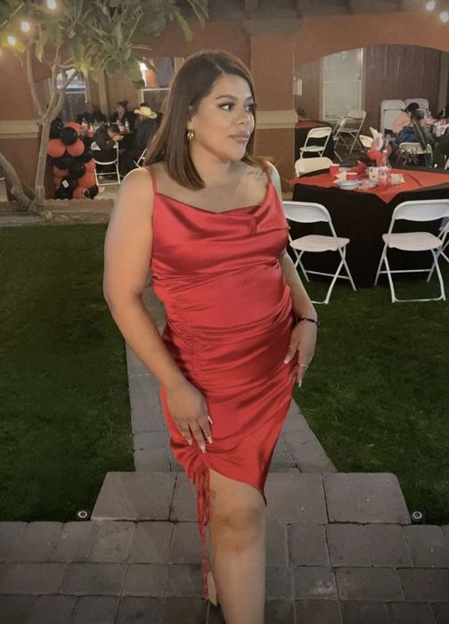 A customer wearing the red dress