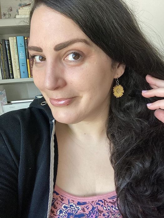 A reviewer's eyes after using the eye cream, showing noticeable improvement.