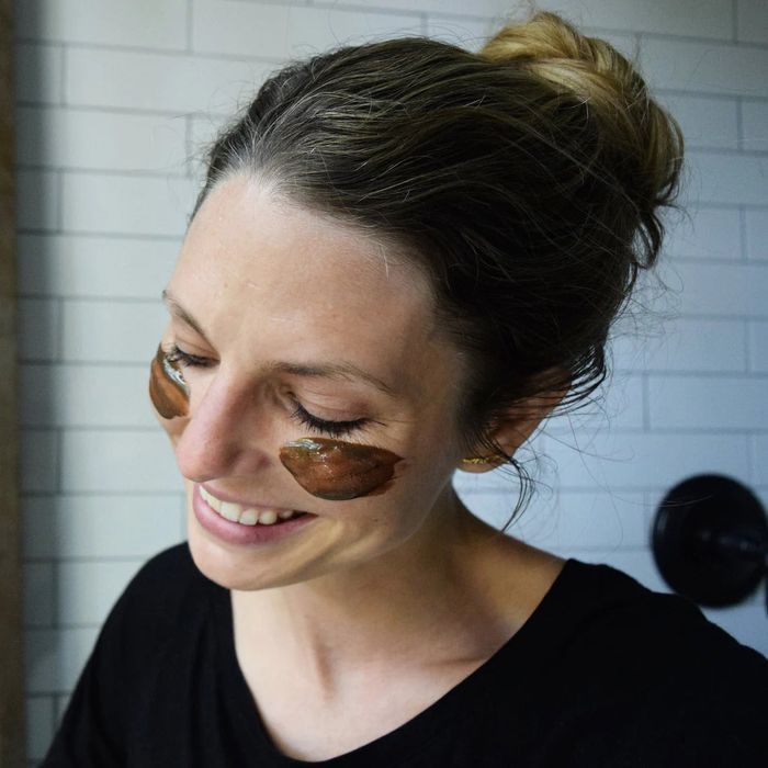 A person with mud cleanser applied to their face.