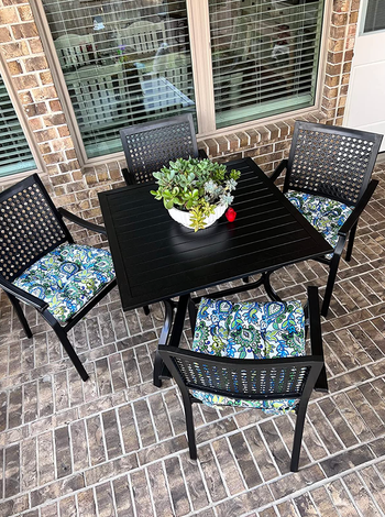 A view of the dining set placed on a patio.