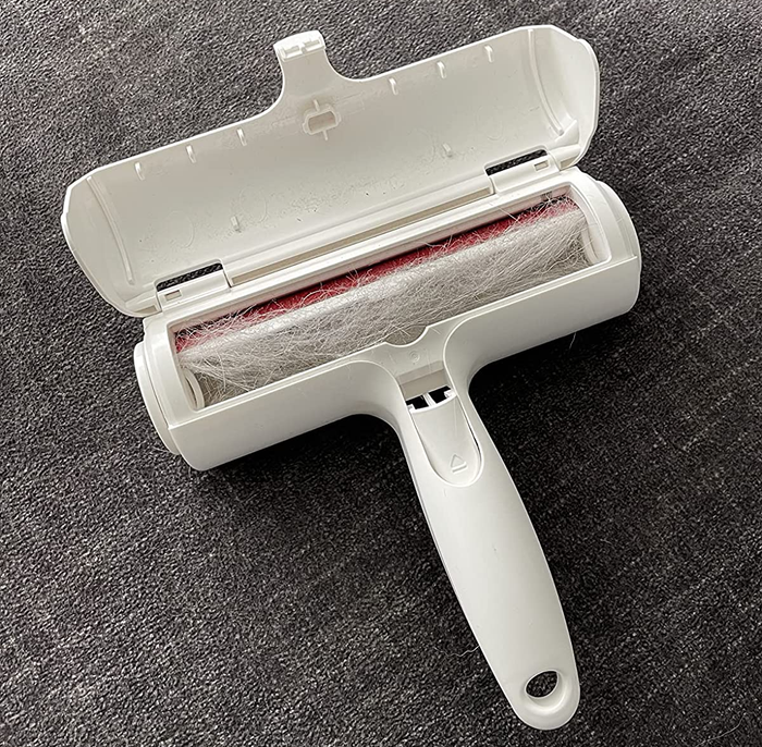 Reviewer’s photo showing the pet hair remover filled with hair