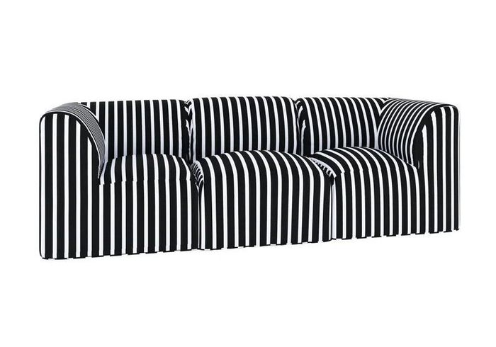 A striped sofa with curved armrests and multiple cushions