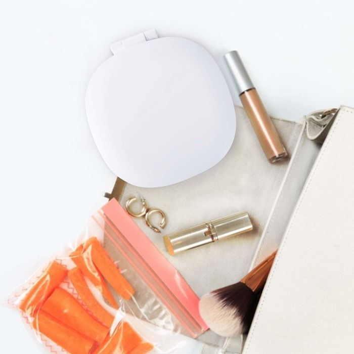 Using the mirror to apply makeup with precision.
