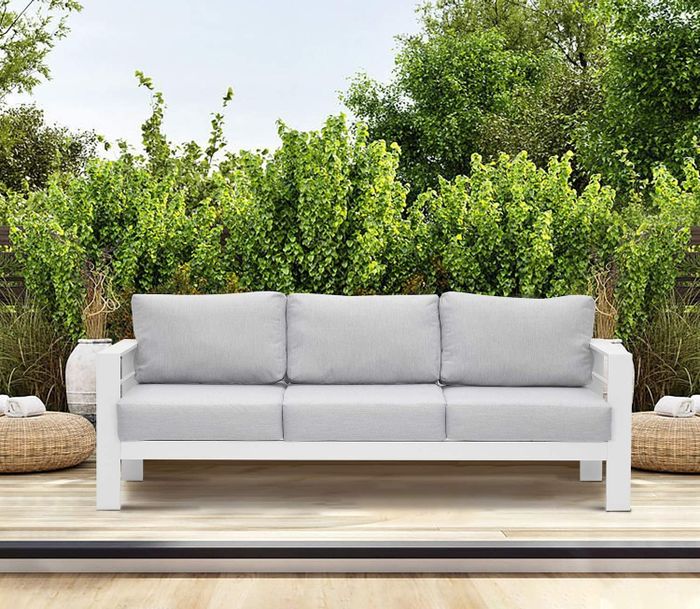 The gray and white metal sofa is displayed