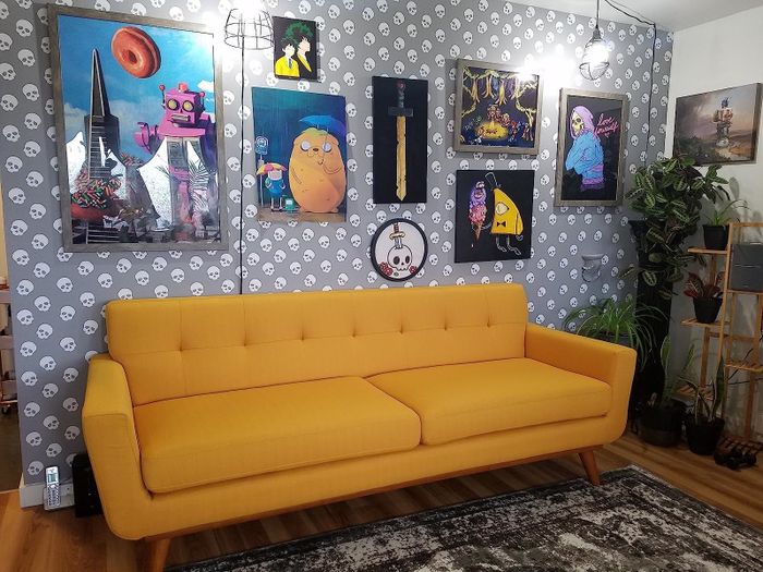 The mustard-colored sofa from the reviewer is displayed