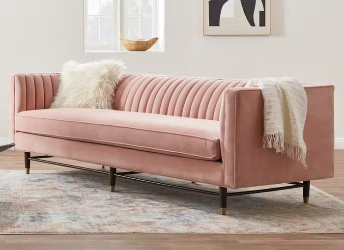 A pink sofa is featured here