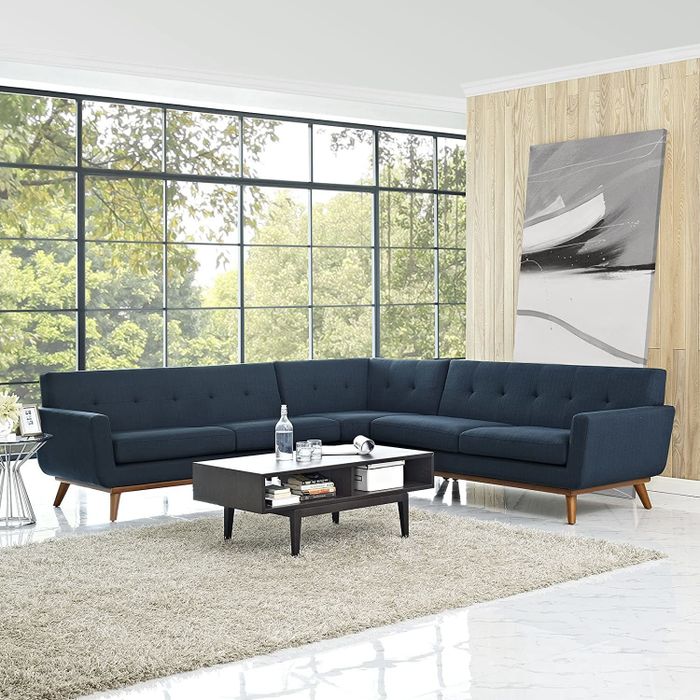 A navy blue sectional sofa is featured here.