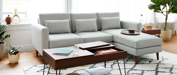 A gray sectional is displayed in a modern living room