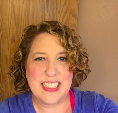 A reviewer showing off their great hair after using the shampoo bar