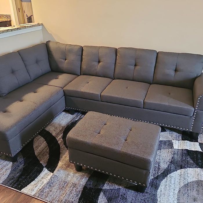 This sectional is paired with a matching ottoman for added comfort and functionality.