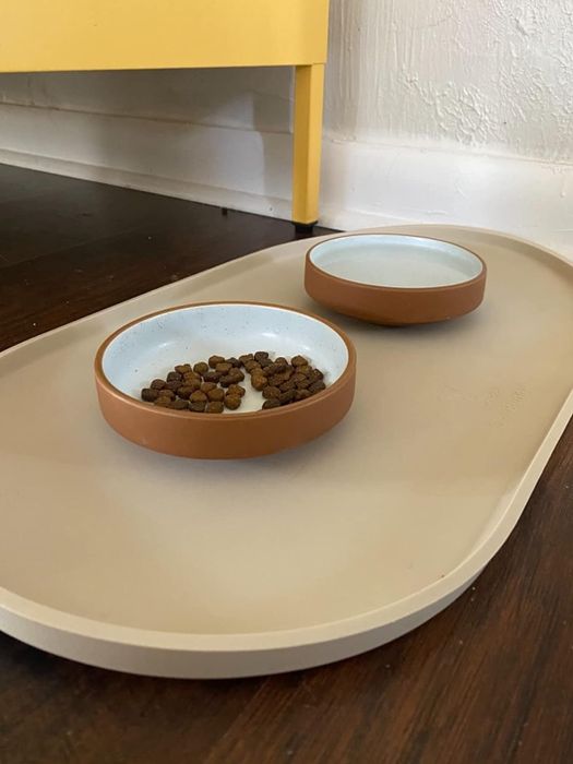 The same placemat, now with a raised lip to catch any spills.