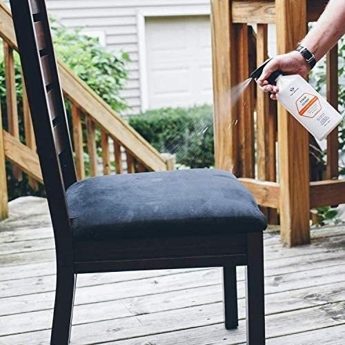 A model applying TriNova Stain Guard to a seat cushion