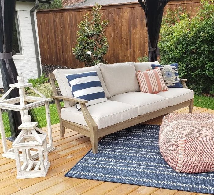 The reviewer’s sofa is pictured on an outdoor patio