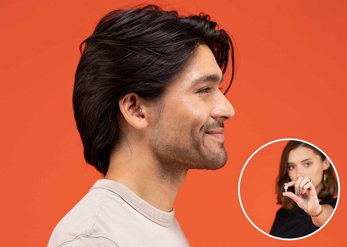 A person wearing earplugs that are practically undetectable