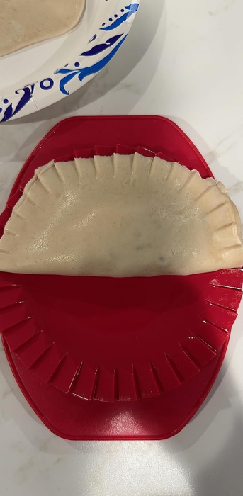 A red dough press tool