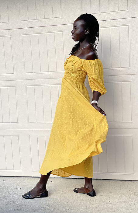 Reviewer wearing the dress in yellow