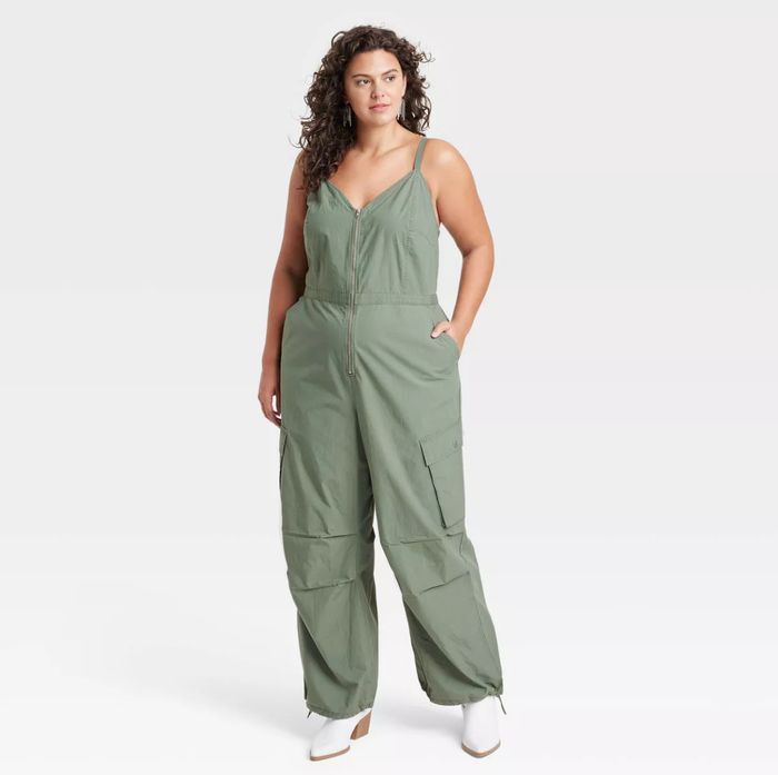 A model showcasing the olive-colored jumpsuit.