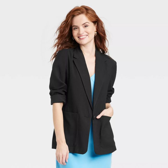 A model dressed in the relaxed-fit blazer