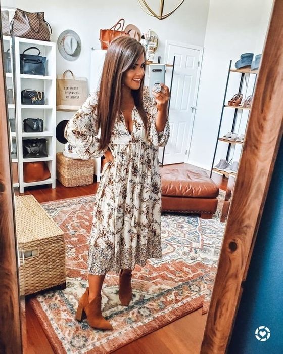Reviewer wearing the dress in a white and brown floral pattern