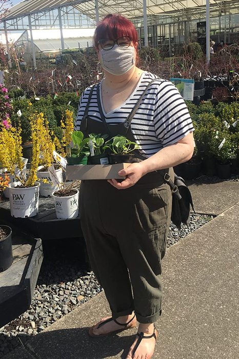 reviewer sporting the green overalls