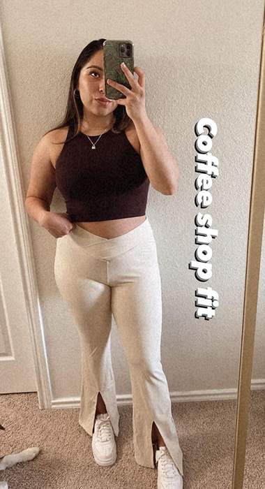 A reviewer wearing the white crossover leggings.