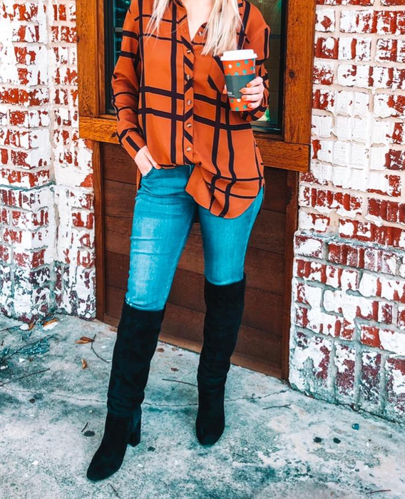 Another reviewer styles the brown striped button-down shirt.