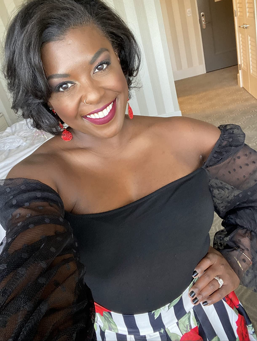 A reviewer confidently rocks an off-shoulder look, showcasing their stylish sleeve choice.