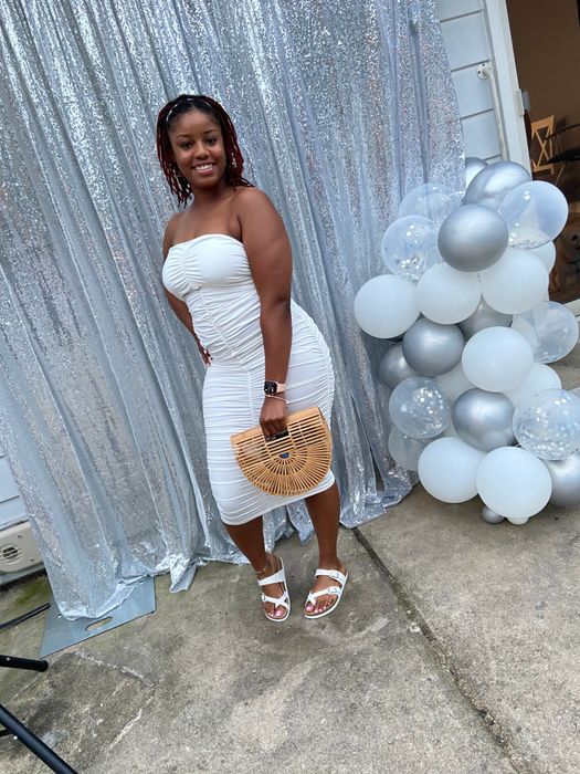 reviewer styling the white sandals with a white ruched bodycon dress