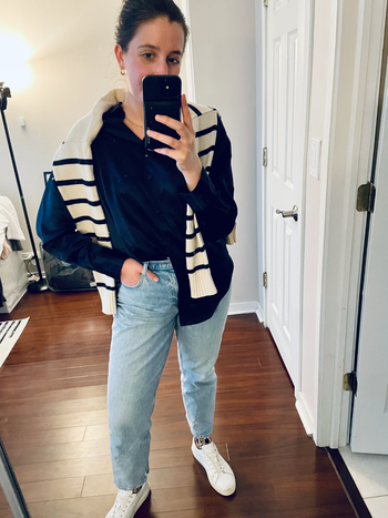 A writer showcases the jeans in a light wash.