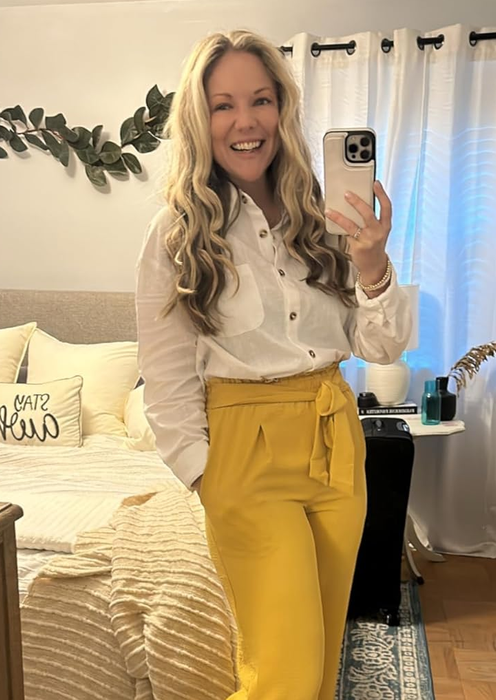 A reviewer wearing the top tucked in